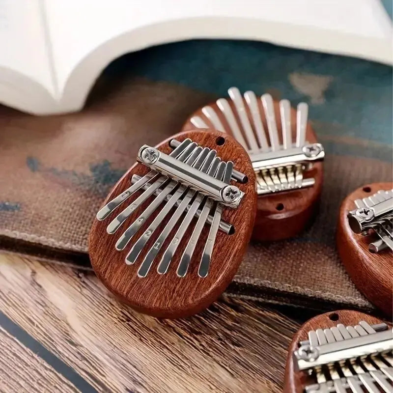 Mini Kalimba de madera de 8 teclas, de alta calidad, exquisito piano de pulgar, marimba musical, buen accesorio colgante, regalo